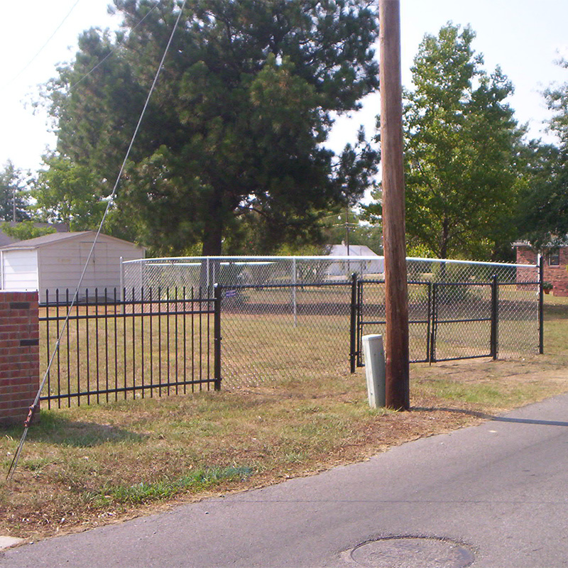 decorative steel double gate with chain link fencing